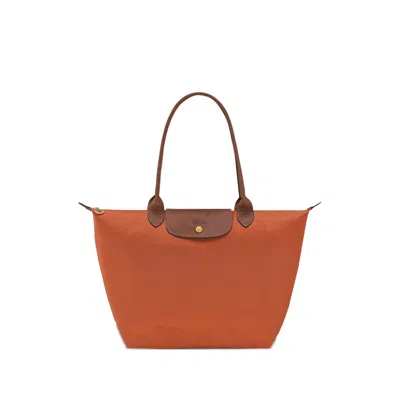 Longchamp Le Pilage Original Red Medium Tote Bag With Two Top Handles And Embossed Logo On The Front In Canvas