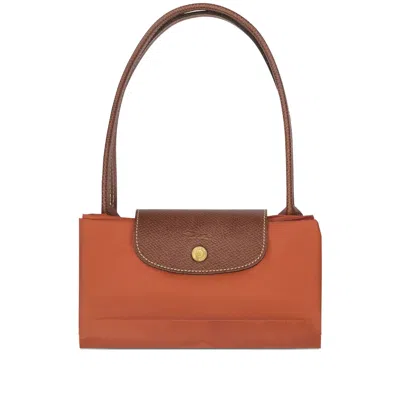 Longchamp Le Pilage Original Red Medium Tote Bag With Two Top Handles And Embossed Logo On The Front In Canvas