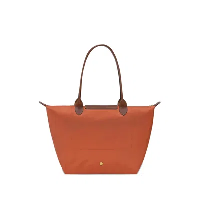 Longchamp Le Pilage Original Red Medium Tote Bag With Two Top Handles And Embossed Logo On The Front In Canvas
