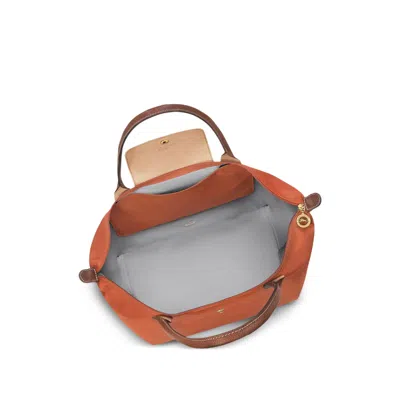 Longchamp Le Pilage Original Red Medium Tote Bag With Two Top Handles And Embossed Logo On The Front In Canvas