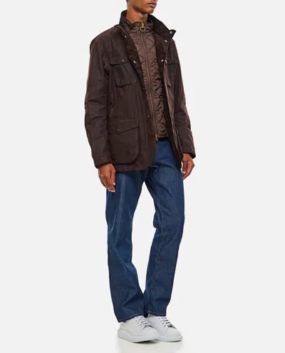 Barbour Waxed Jacket With Elbow Patches And High Neck In Brown