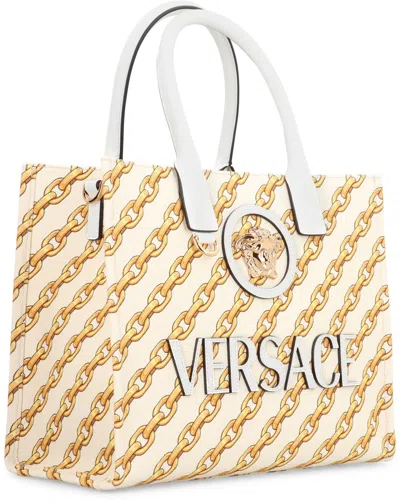 Versace Printed Canvas Small Chain Stripes La Medusa Shopping Bag In Gold