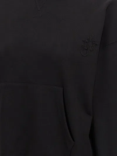 Jw Anderson J. W. Anderson Cropped Black Hoodie With Subtle Branding And Relaxed Fit In Black