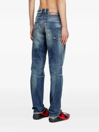 Diesel Relaxed Fit Faded Blue Jeans With Vintage Distressing In Blue