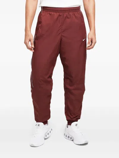 Nike Solo Swoosh Track Pants In Red