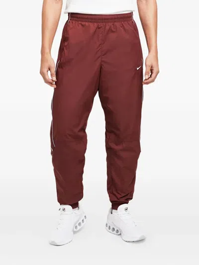 Nike Solo Swoosh Track Pants In Red