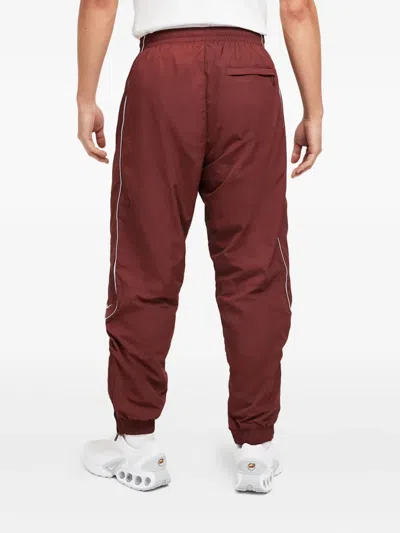 Nike Solo Swoosh Track Pants In Red