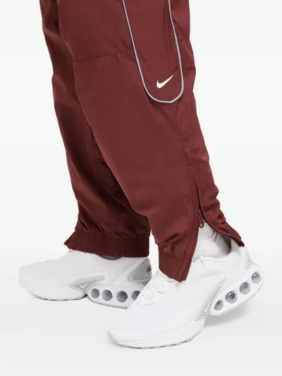 Nike Solo Swoosh Track Pants In Red