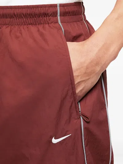 Nike Solo Swoosh Track Pants In Red