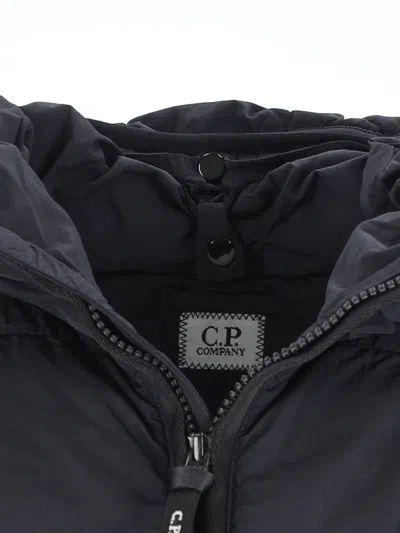 C.p. Company Blue Down Jacket With Fixed Hood And Logo Plaque On The Sleeve In Tech Fabric Man