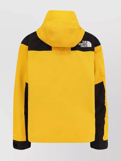 The North Face Windbreaker Jacket With Drawstring And Hood In Yellow