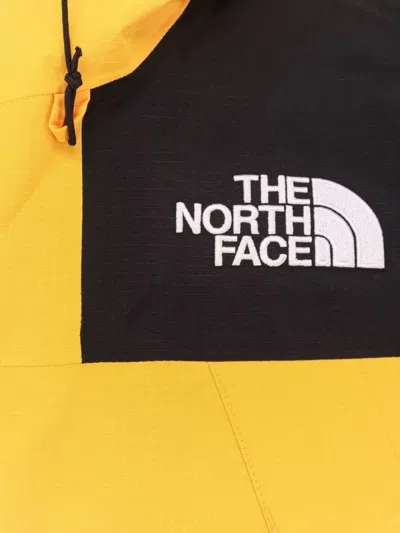 The North Face Windbreaker Jacket With Drawstring And Hood In Yellow