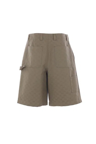 Gucci Embossed-logo Shorts In Brown