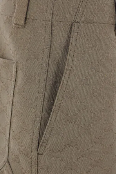 Gucci Embossed-logo Shorts In Brown