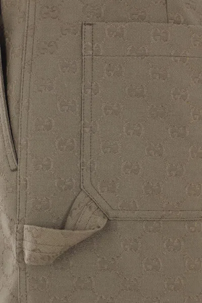 Gucci Embossed-logo Shorts In Brown