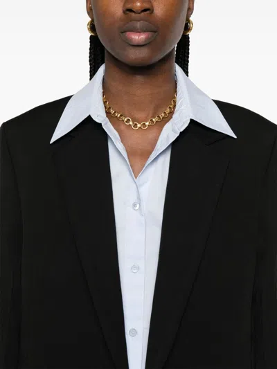 Totême Tailored Single-breasted Coat With Notched Lapels In Black