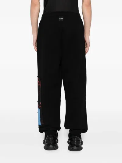 Vetements Graphic-print Trousers In Black
