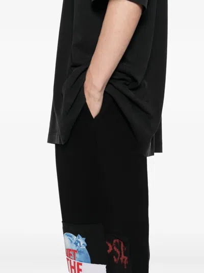Vetements Graphic-print Trousers In Black