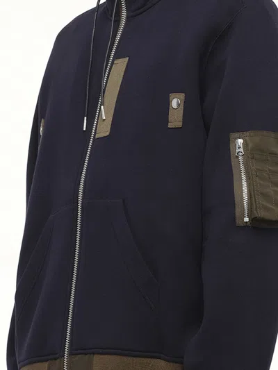 Sacai Hooded Knitwear With Ribbed Hem In Blue