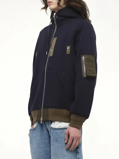 Sacai Hooded Knitwear With Ribbed Hem In Blue