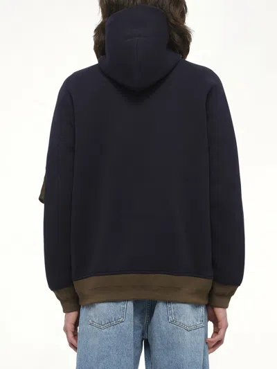 Sacai Hooded Knitwear With Ribbed Hem In Blue