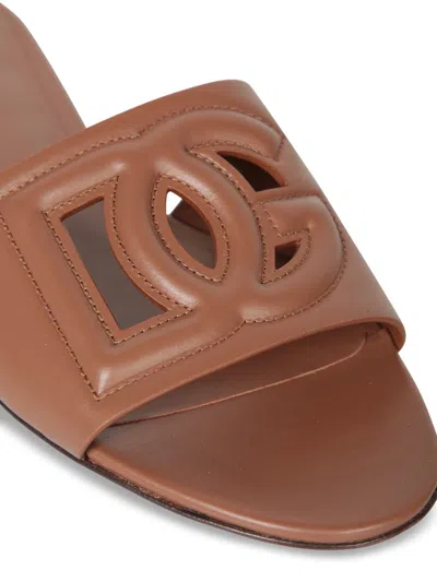 Dolce & Gabbana Slide Sandals With Cut Out Logo In Leather Woman In Brown