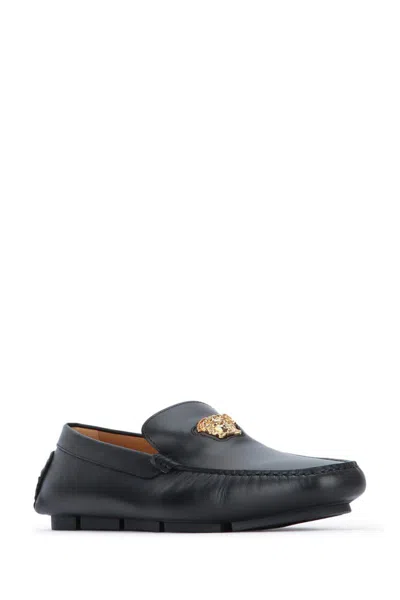 Versace Logo Plaque Leather Loafers In Black