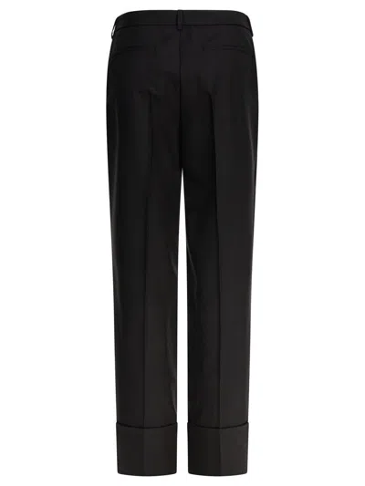 Valentino Garavani Trousers In Black