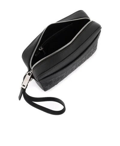 Ferragamo Logo Embossed Shoulder Bag In Black