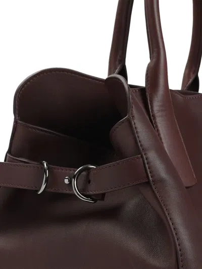 扣环开合皮质手提包