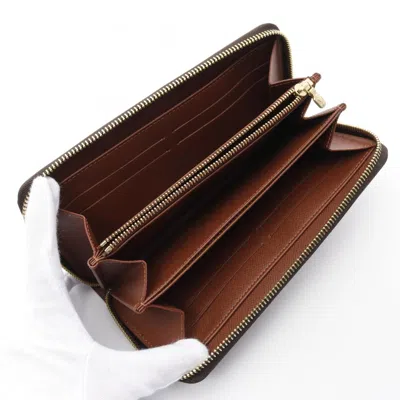 Pre-owned Louis Vuitton Brown Coated Canvas Monogram Pvc Long Wallet (bi-fold) ()