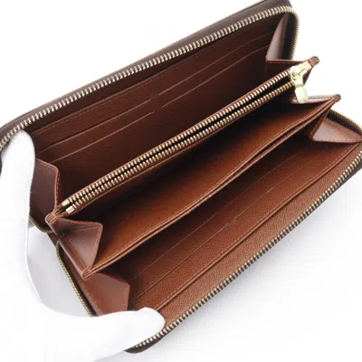 Pre-owned Louis Vuitton Brown Coated Canvas Monogram Pvc Long Wallet (bi-fold) ()