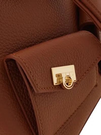 Ferragamo Geometric-flap Drawstring Backpack In Brown