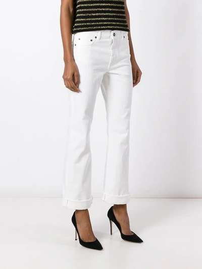 Shop Saint Laurent Original Cropped Flared Jeans In White