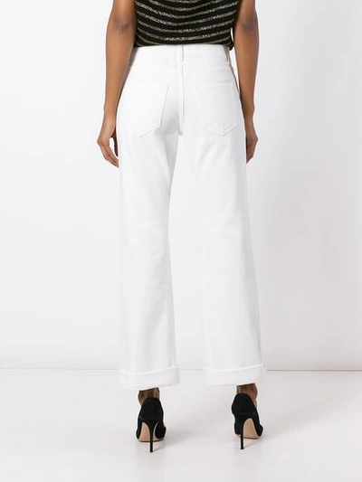 Shop Saint Laurent Original Cropped Flared Jeans In White