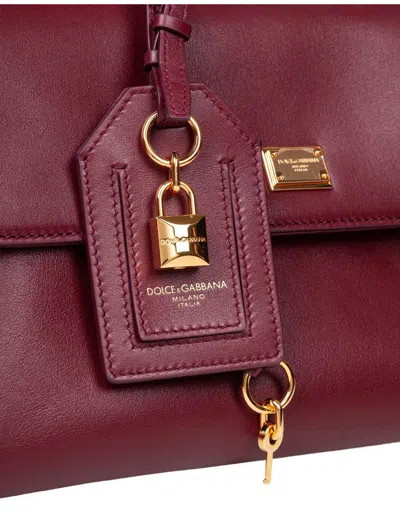 Dolce & Gabbana Bordeaux Handbag With Key And Padlock Detail And Adjustable And Removable Shoulder Strap In Red