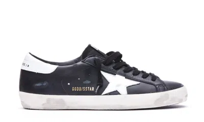 Golden Goose 'super-star' Black Low Top Sneakers With Logo Patch And Suede Details In Leather Man In Black