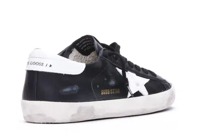 Golden Goose 'super-star' Black Low Top Sneakers With Logo Patch And Suede Details In Leather Man In Black