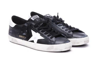 Golden Goose 'super-star' Black Low Top Sneakers With Logo Patch And Suede Details In Leather Man In Black