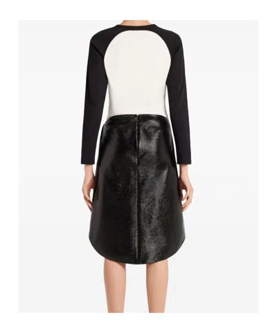 Courrèges Long-sleeved Contrast T-shirt With Rounded Hem And Logo Print In Black