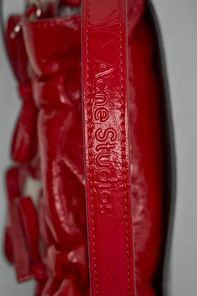 Acne Studios Multipocket Crinkle Patent Leather Top Handle Bag In Red