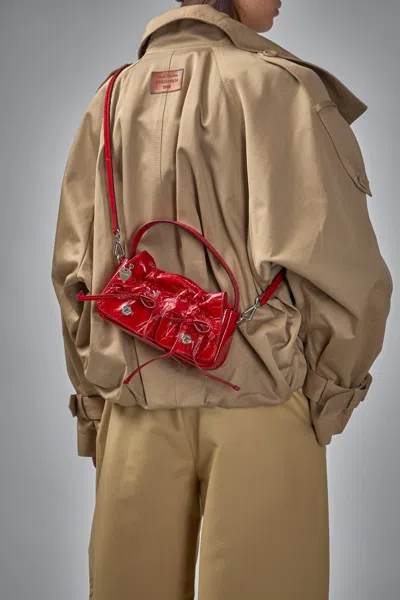Acne Studios Multipocket Crinkle Patent Leather Top Handle Bag In Red