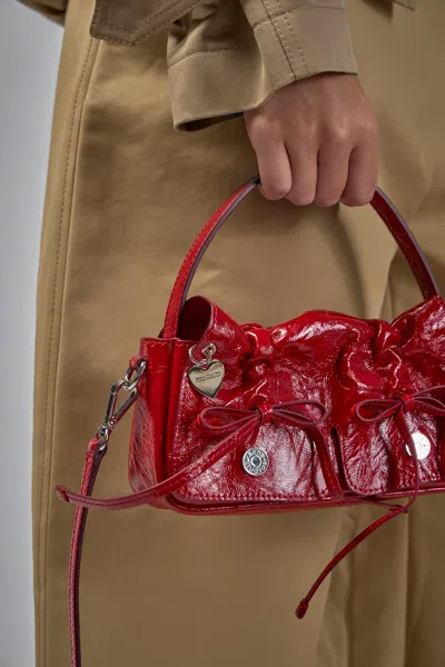 Acne Studios Multipocket Crinkle Patent Leather Top Handle Bag In Red