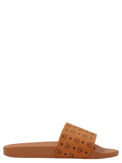 Mcm Male Monogram Print Rubber Slides In Brown