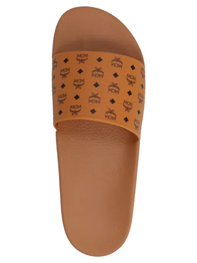 Mcm Male Monogram Print Rubber Slides In Brown