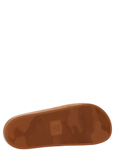 Mcm Male Monogram Print Rubber Slides In Brown