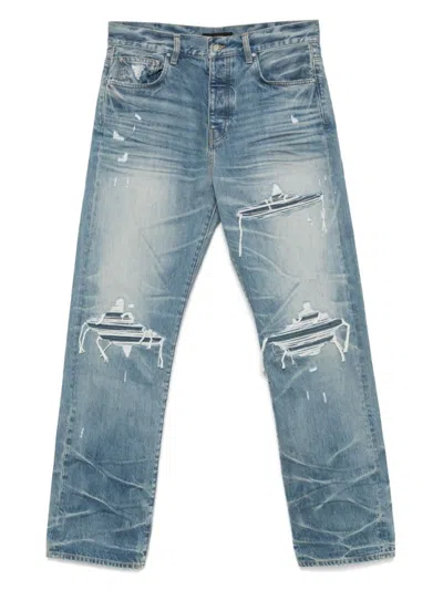 Amiri Men Blue Jeans With Ripped Details On The Front And Logo Patch On The Rear In Denim Man In Blue