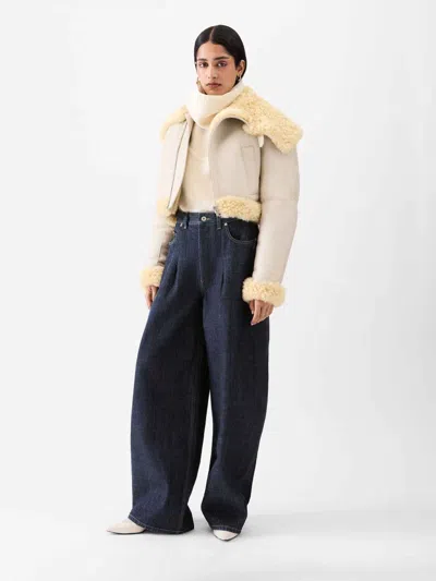 Jacquemus Ovalo Denim Trousers Featuring Pockets In Blue