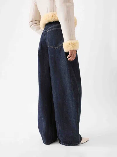 Jacquemus Ovalo Denim Trousers Featuring Pockets In Blue