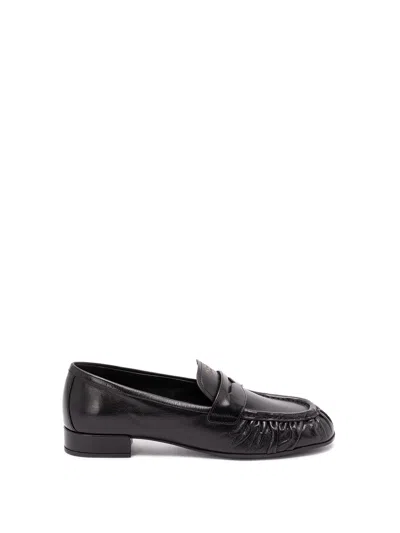 Prada Rounded Toe Loafers With Textured Detailing And Low Block Heel In Black